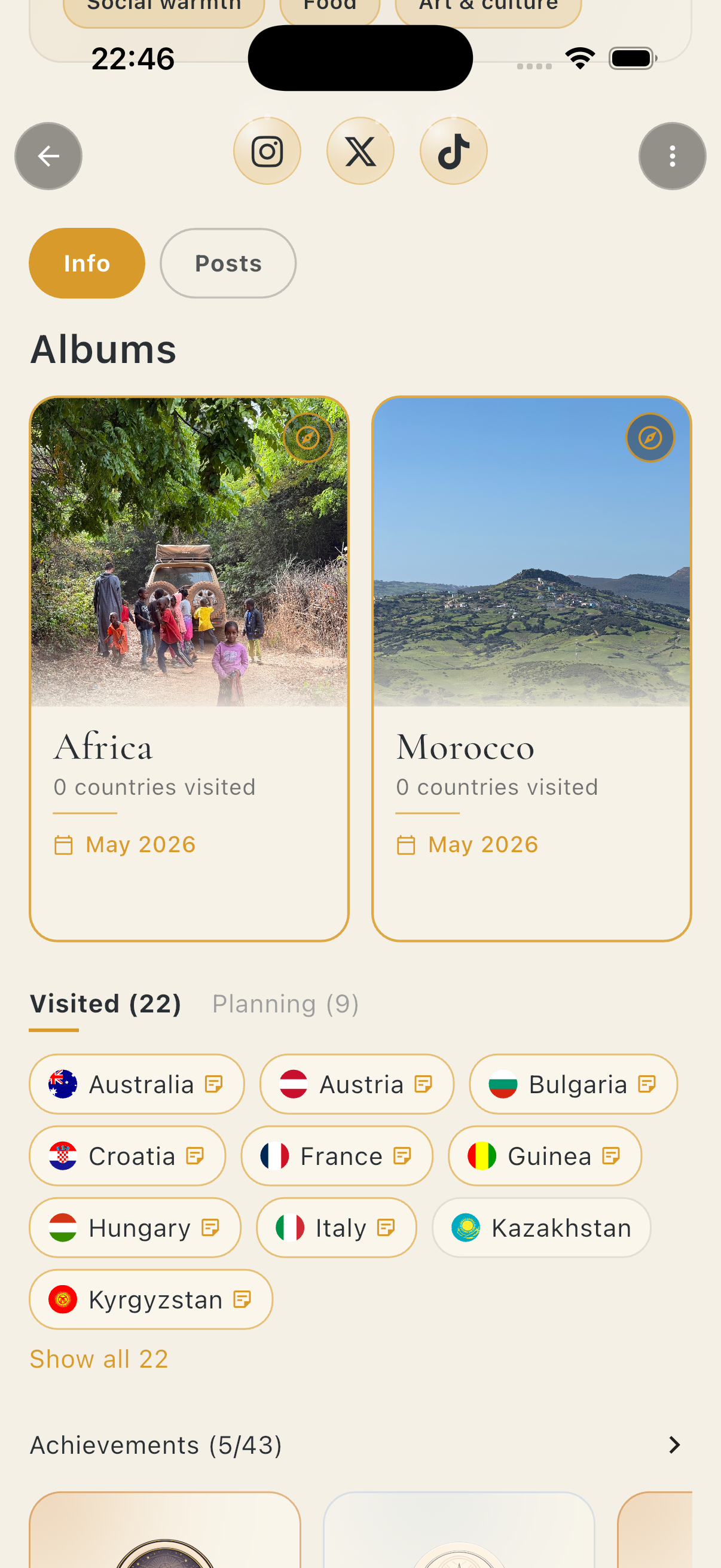 NomadMap profile — Africa and Morocco photo album cards, a Visited (22) chip list with country flags from Australia to Kyrgyzstan, a Planning (9) counter and an achievements rail
